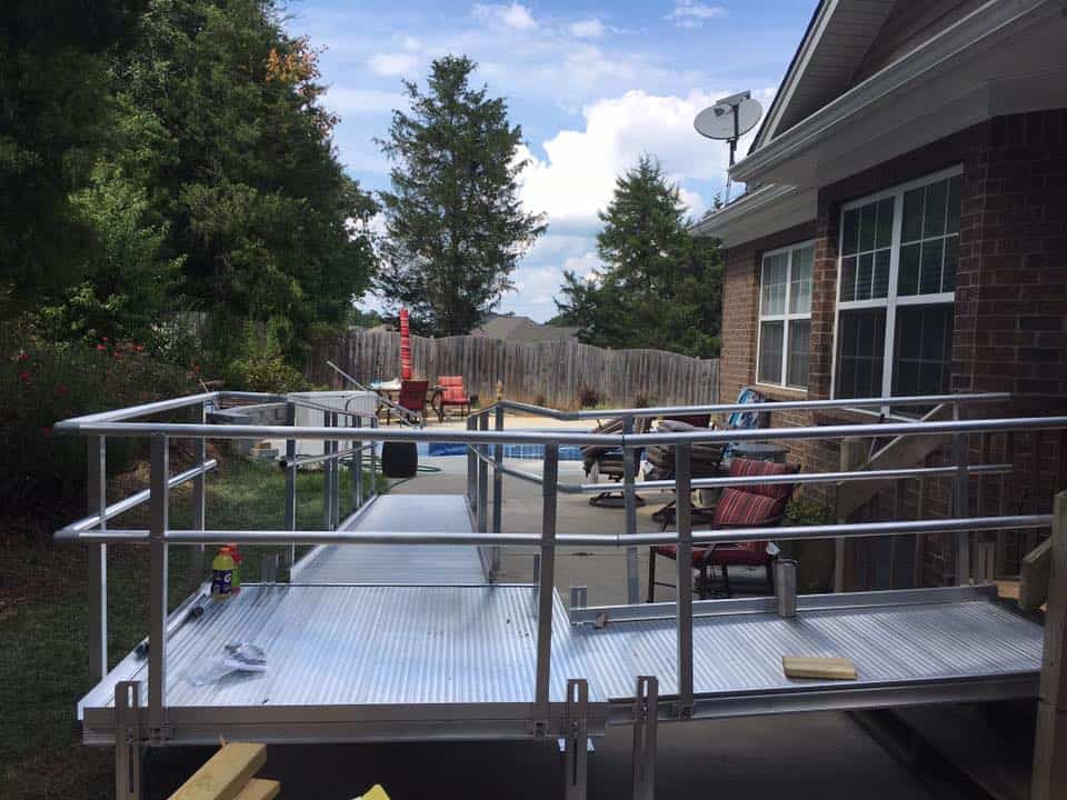 a wheelchair ramp in a backyard